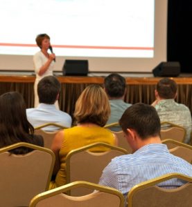 Woman Speaking in auditorium